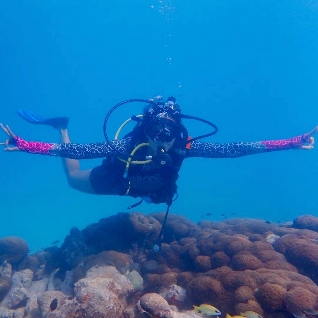 woman diving coral rashguard Loop Swim 